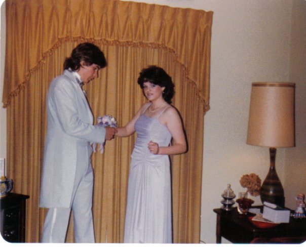 This is me putting on a wrist corsage on my prom date, Ruth Ann Snider. This would be 1983 and the first and last time I've ever worn a tux.